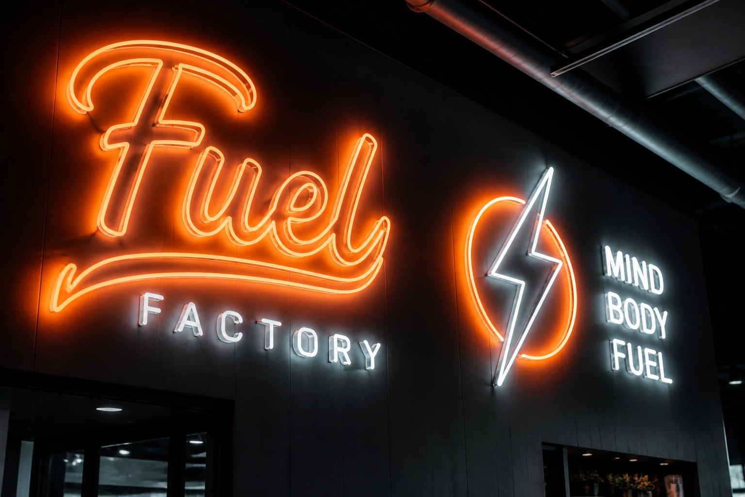 Custom glowing neon signs on a dark wall